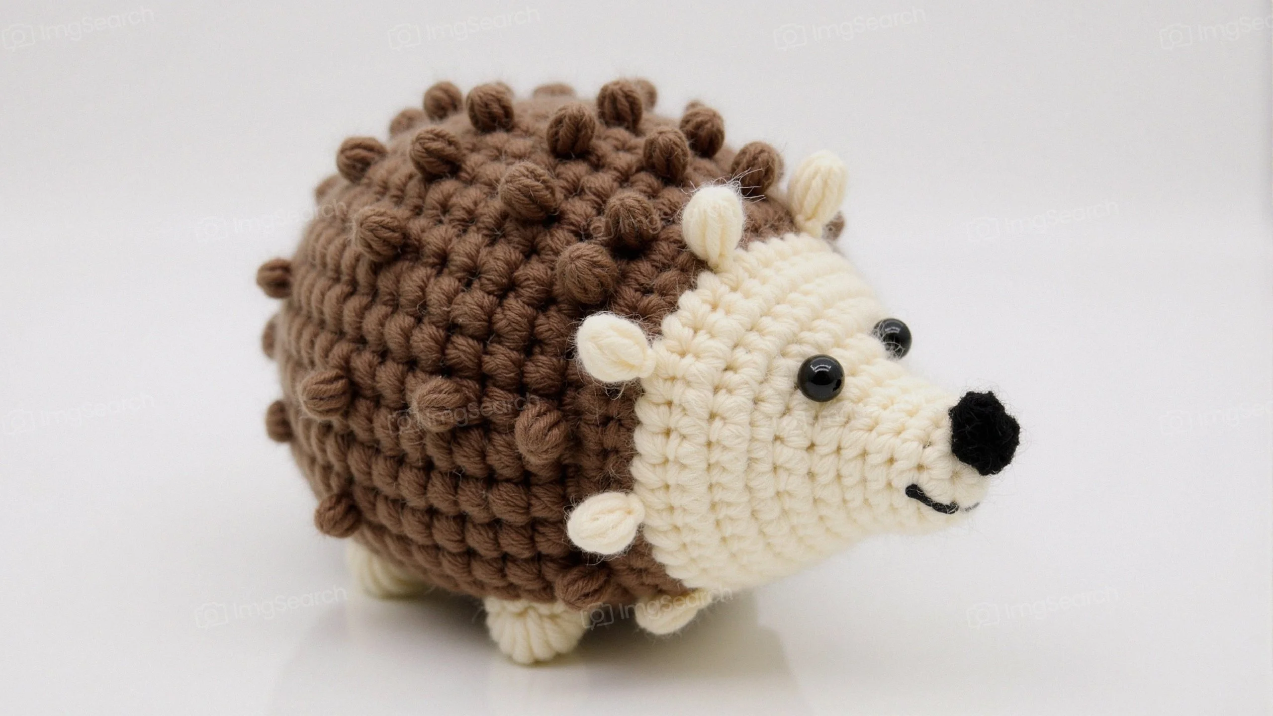 Crocheted hedgehog toy with brown cream yarn
