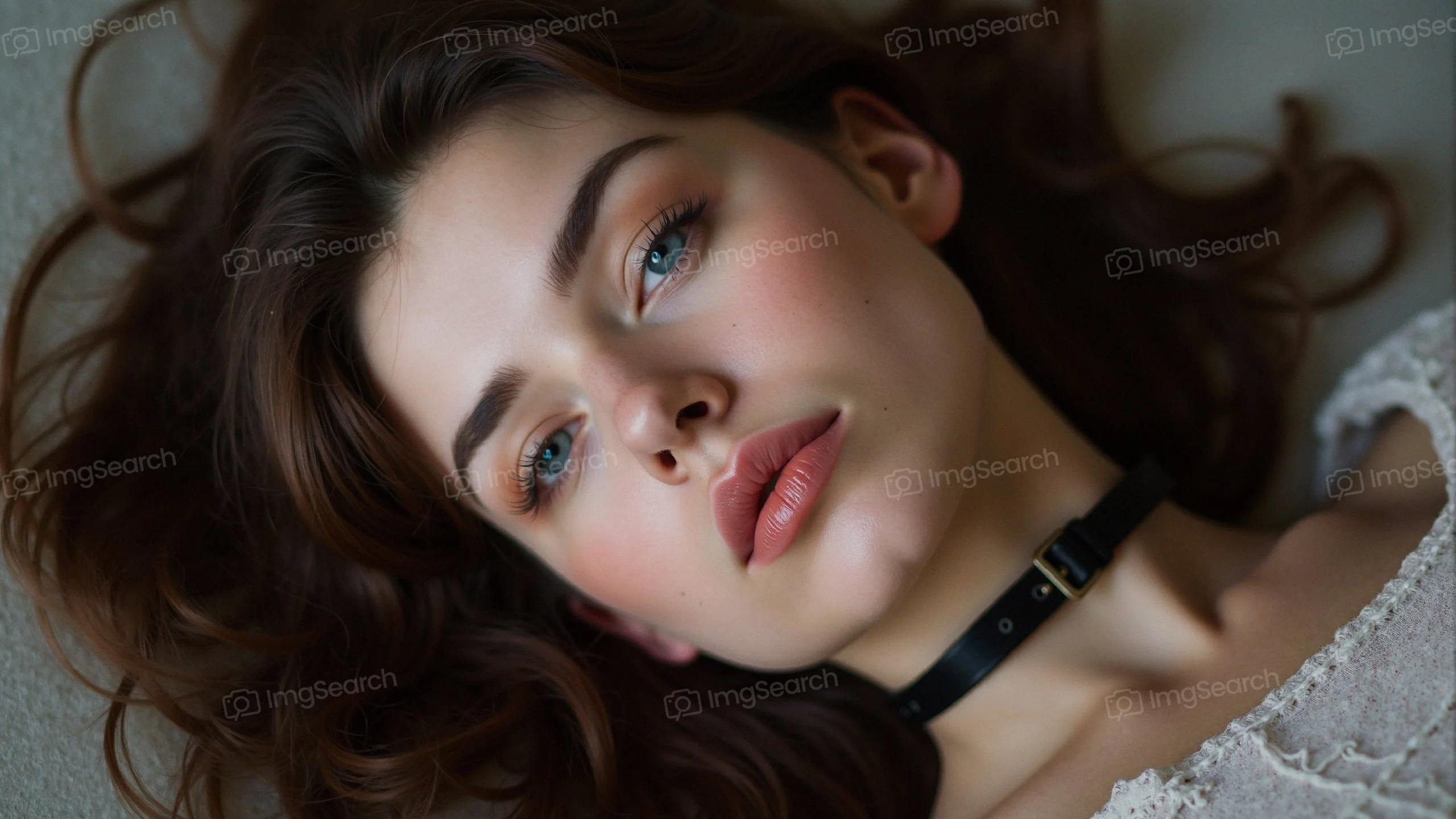 Close-up portrait of a young woman with wavy hair a choker