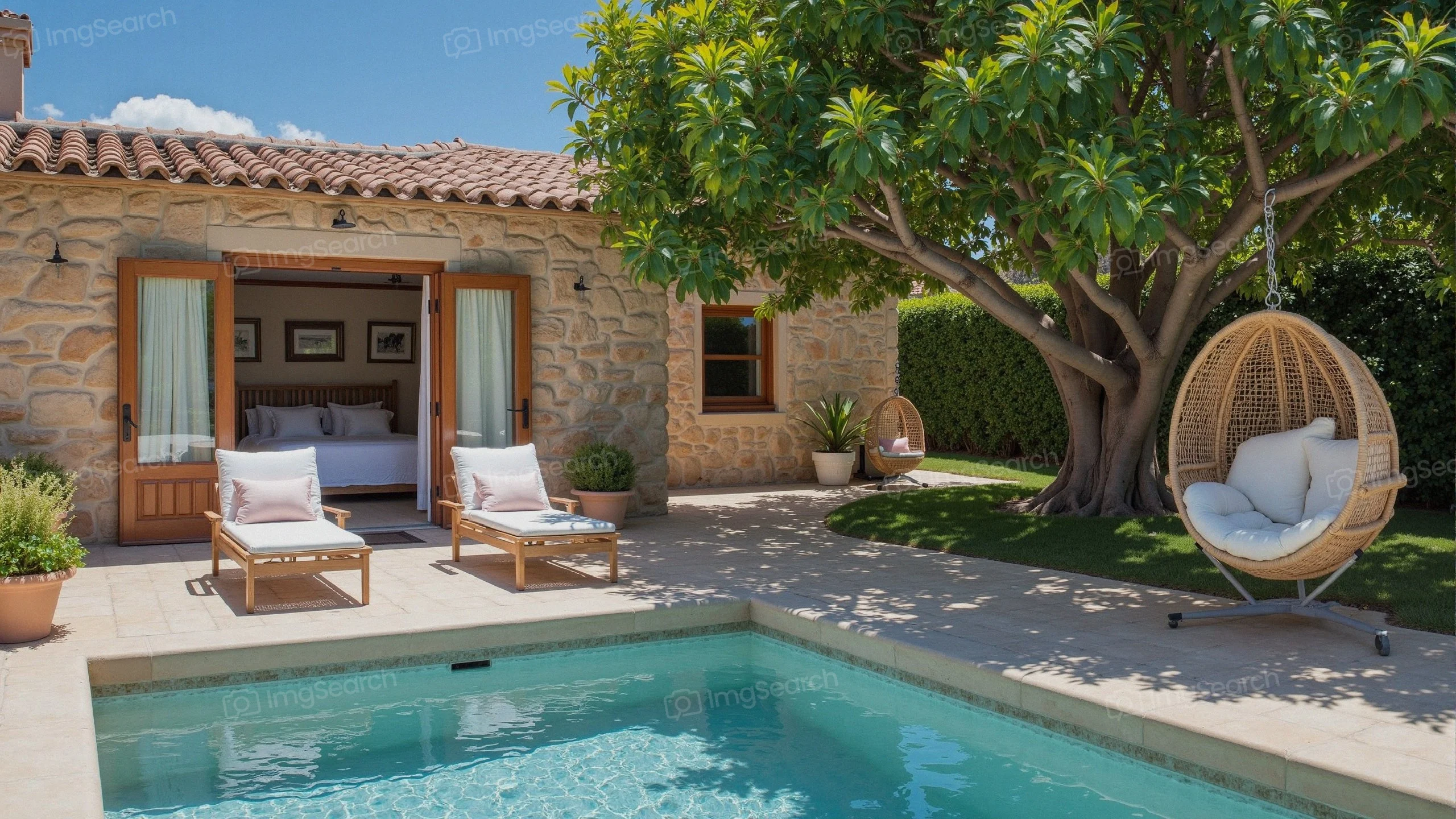 Cozy stone house with swimming pool hanging chair surrounded by lush greenery