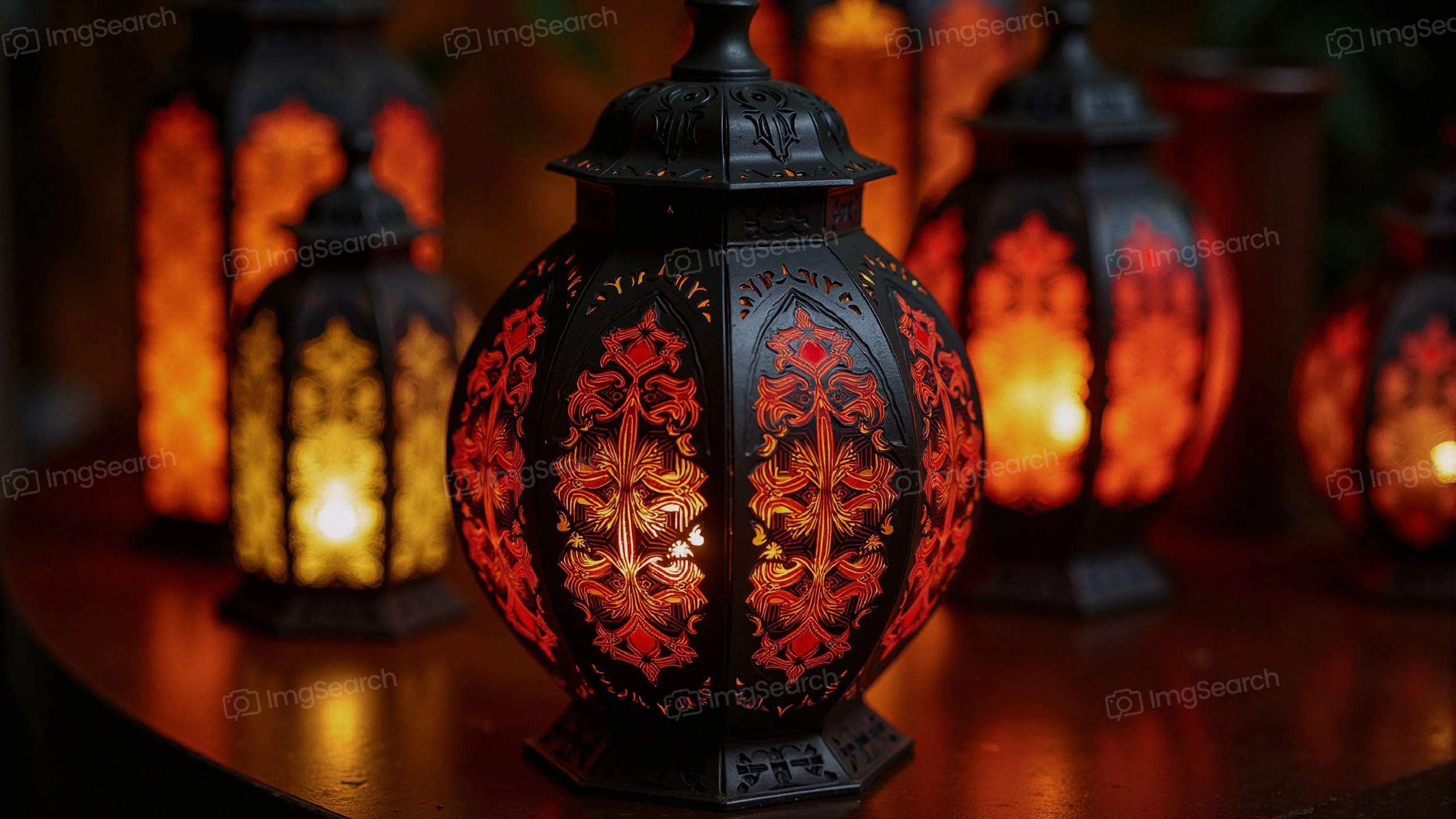 A set of decorative lanterns with intricate designs glowing in warm colors.