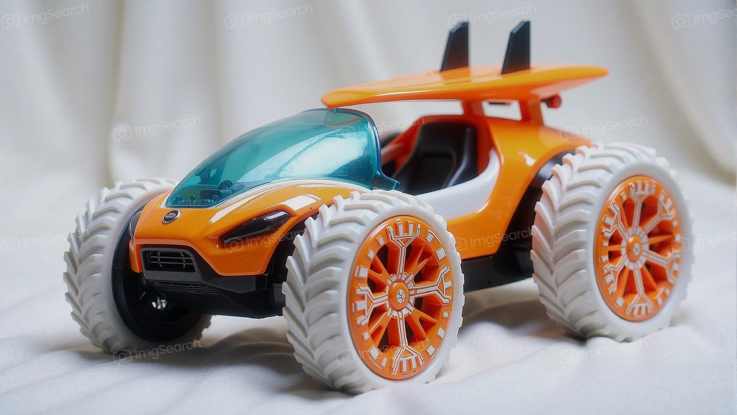 A colorful off-road toy car featuring large tires a sporty design