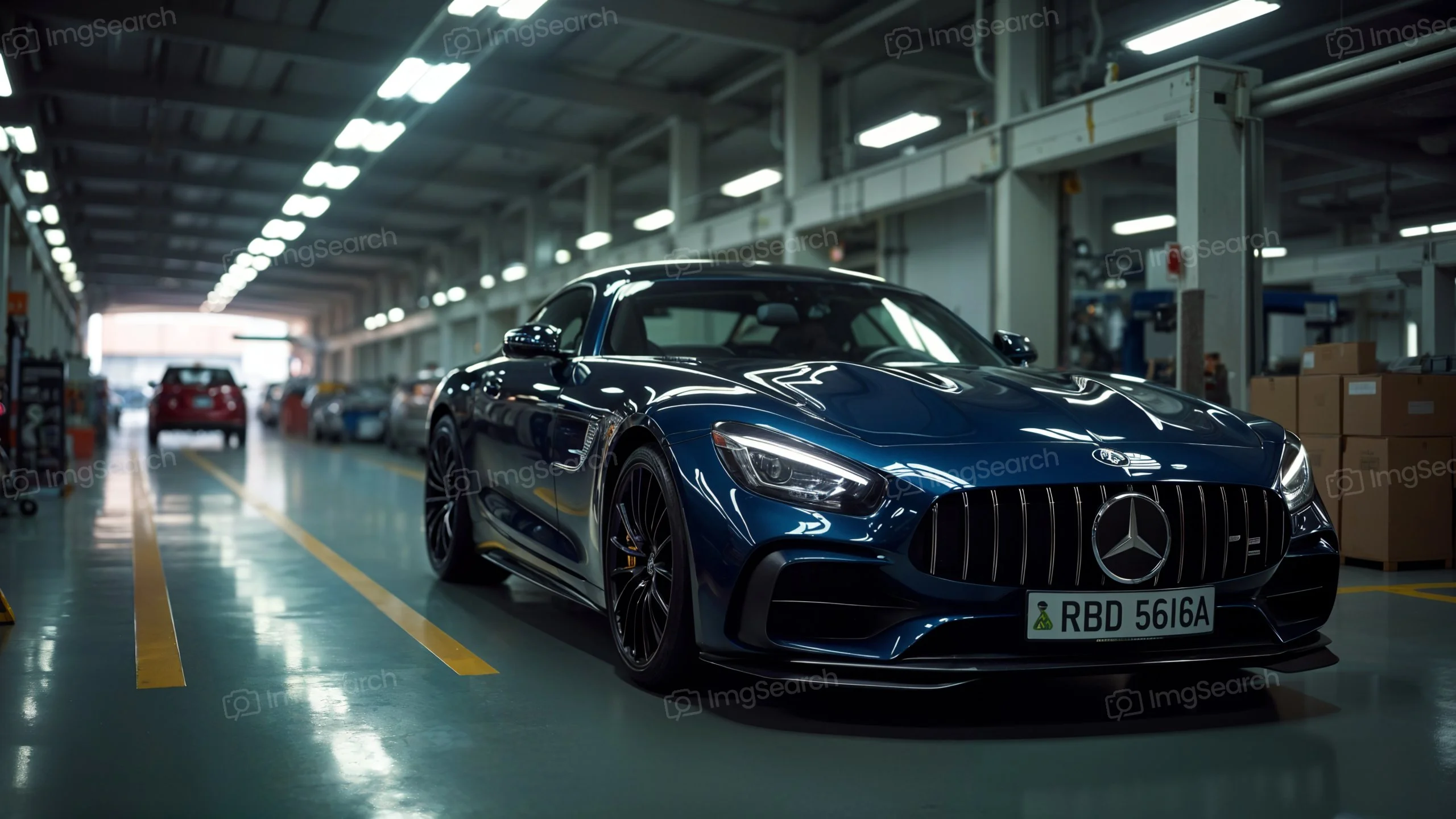 Blue Mercedes-AMG GT parked in an automotive workshop
