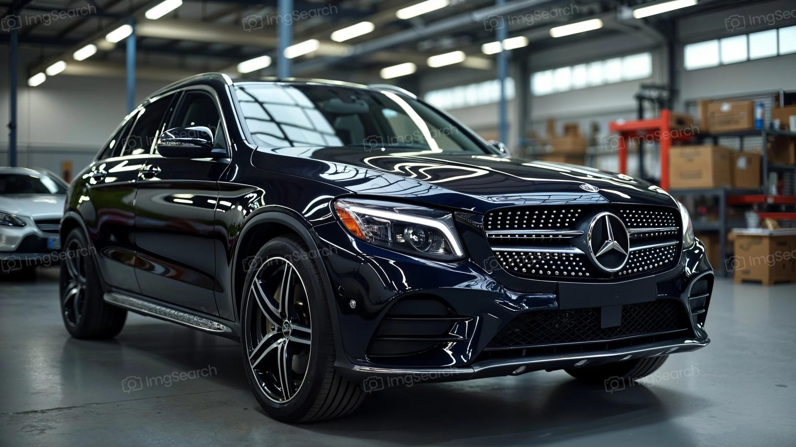Black Mercedes-Benz GLC SUV in an automotive workshop