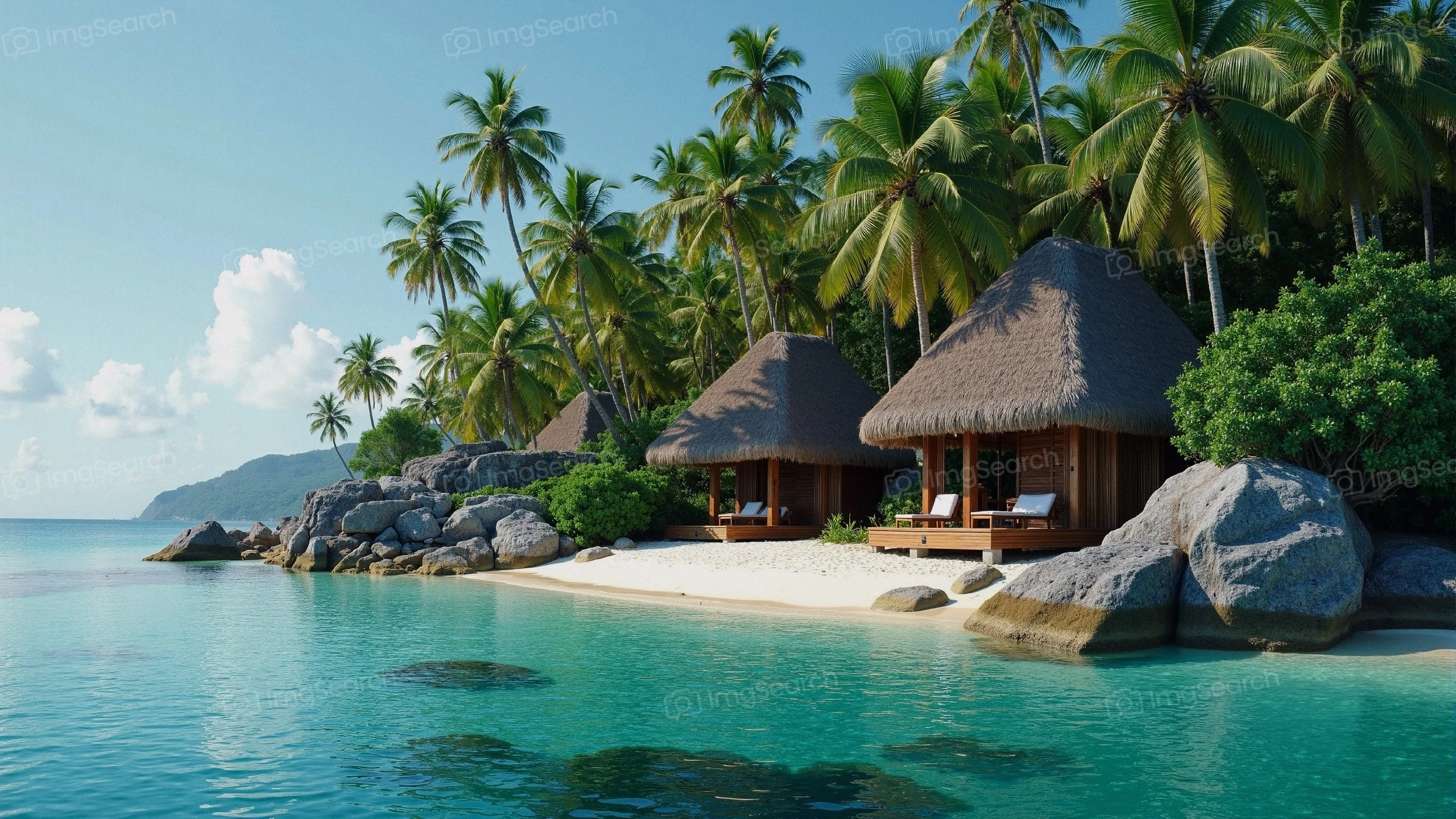 Tropical beach with bungalows palm trees