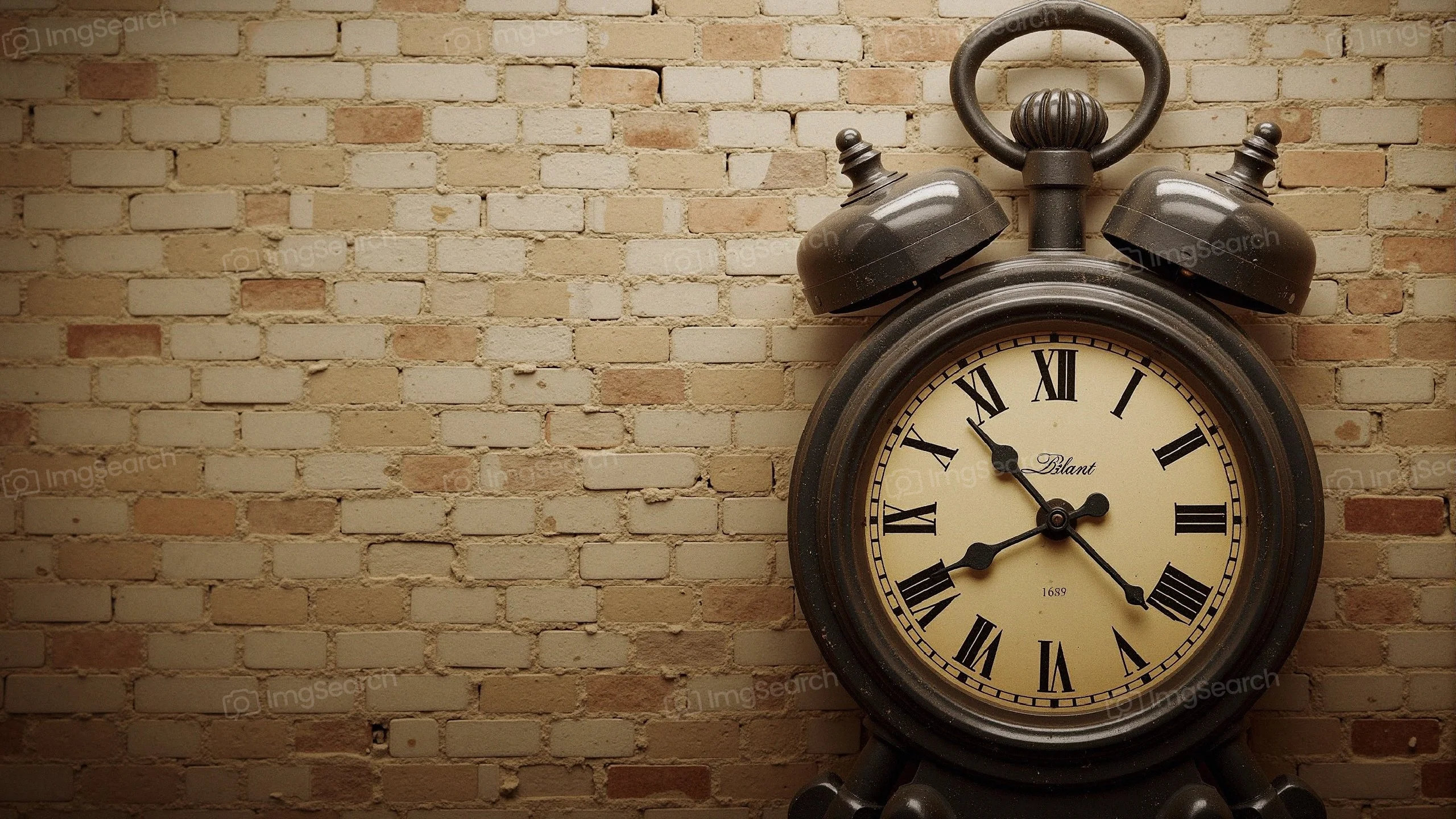 Close-up of a vintage alarm clock on a textured background